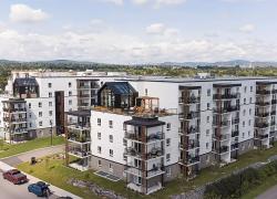 Le milieu du bâtiment durable est convié à une soirée technique consacrée à un projet emblématique de construction bois à Québec : le KOS par LOGISCO. Crédit : Logisco